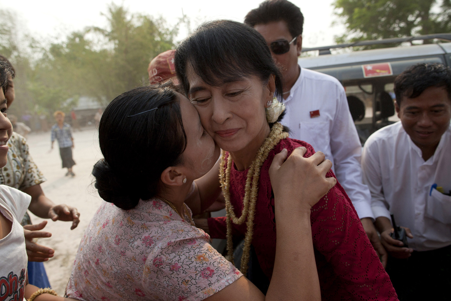 April 1, 2012.  A supporter kisses Aung San Suu Kyi, leader of the National League for Democracy (NLD), as she visits polling stations in her constituency as Burmese people vote in the parliamentary elections in Kaw Hmu, Myanmar.