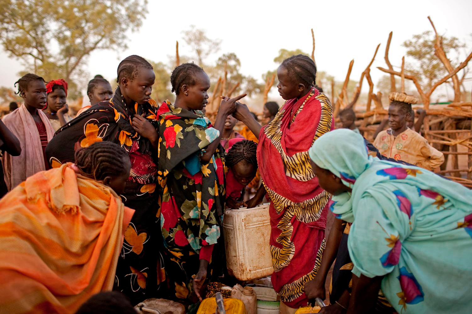 Two Nuba women argue at a water point in the Yida refugee camp. Water is in extremely short supply in the camp, which has daily temperatures of more than 115 degrees. Women and children often stand in line for up to ten hours in order to fill one jerry can. Arguments and fist fights are common.