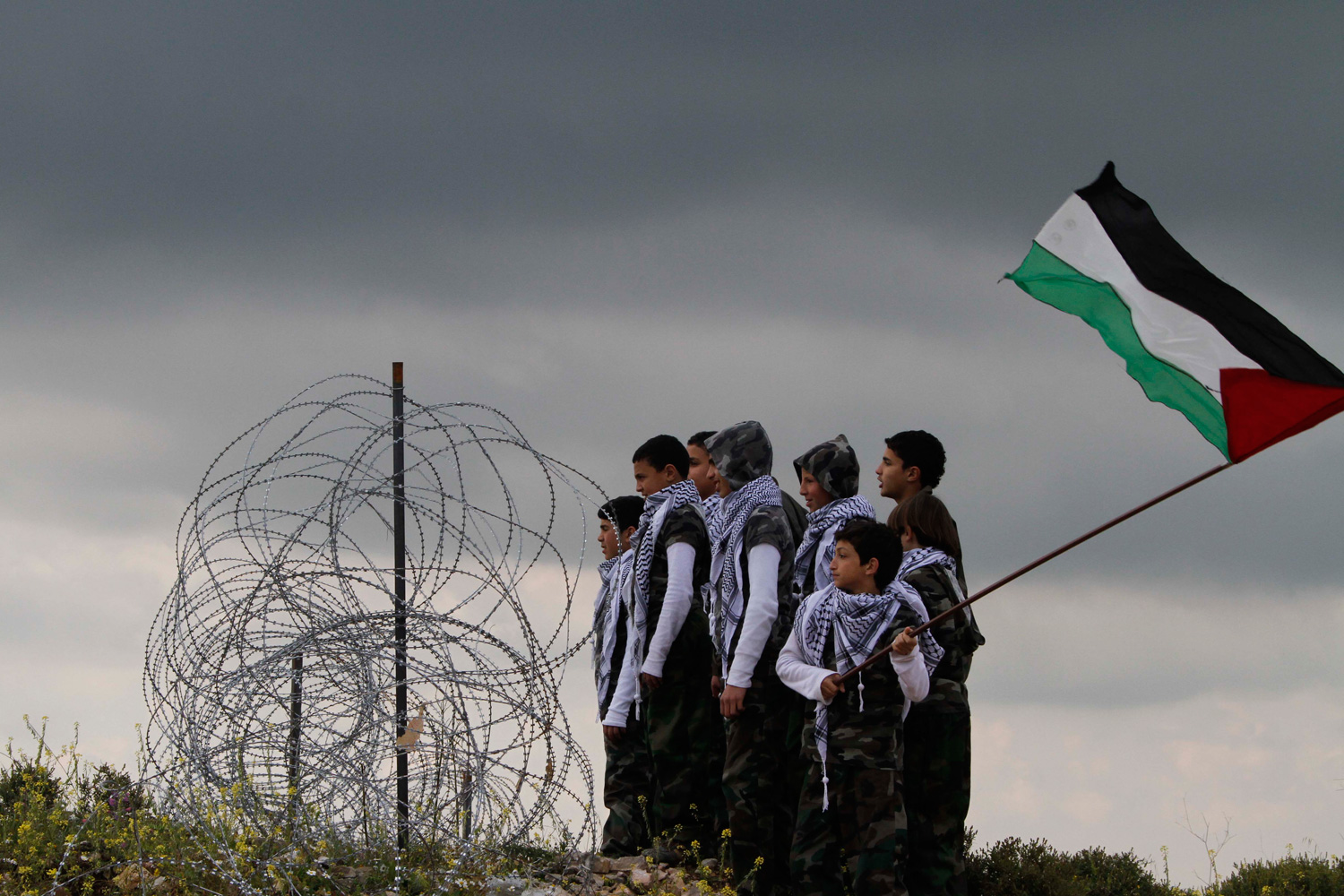 March 30, 2012. Palestinian boys look to the direction of the Lebanese-Israeli border during a Palestinian rally to mark Land Day, in the southern Lebanese village of Arnoun.