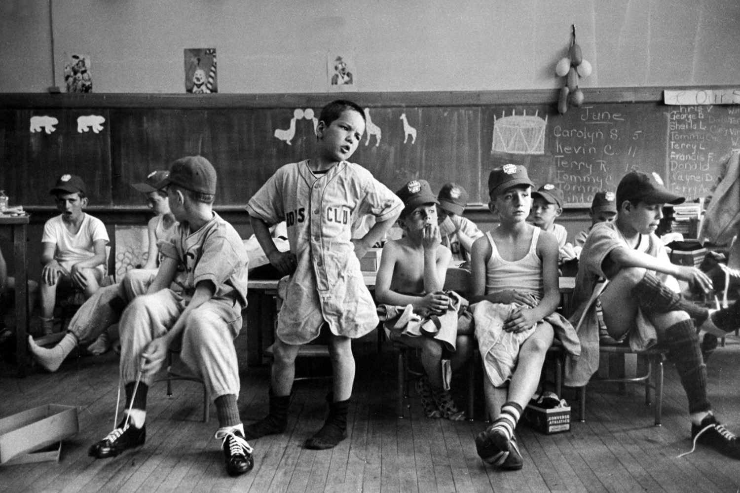 Little Leaguers in Manchester, N.H., dress in a schoolroom before their first game of the season, as their formidable leader, Dick Williams, demands to know where the rest of the uniforms are.