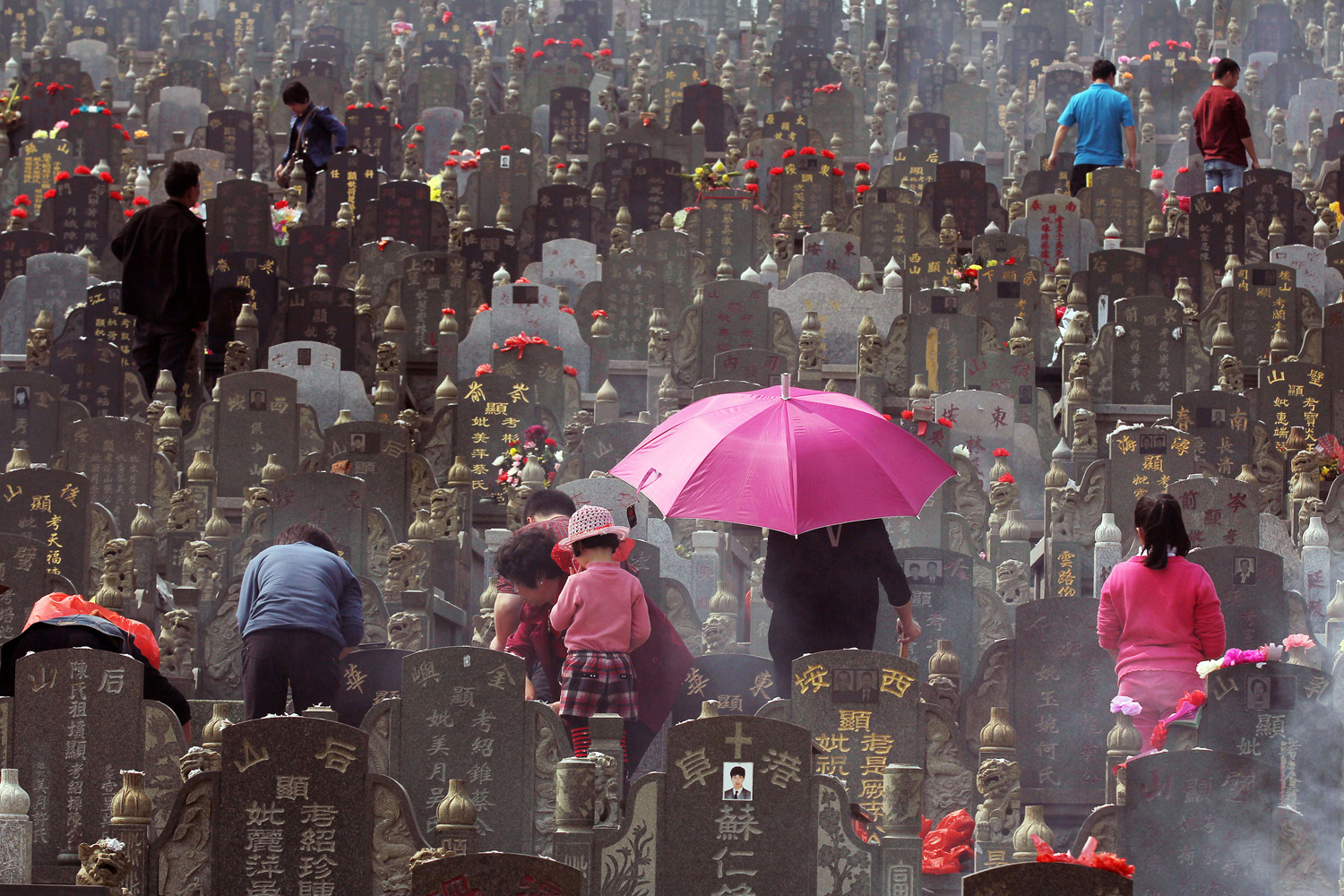 April 3, 2012. People visit the tombs of their loved ones in a cemetery in Jinjiang, China, during the Qingming Festival, or Tomb-Sweeping Day.