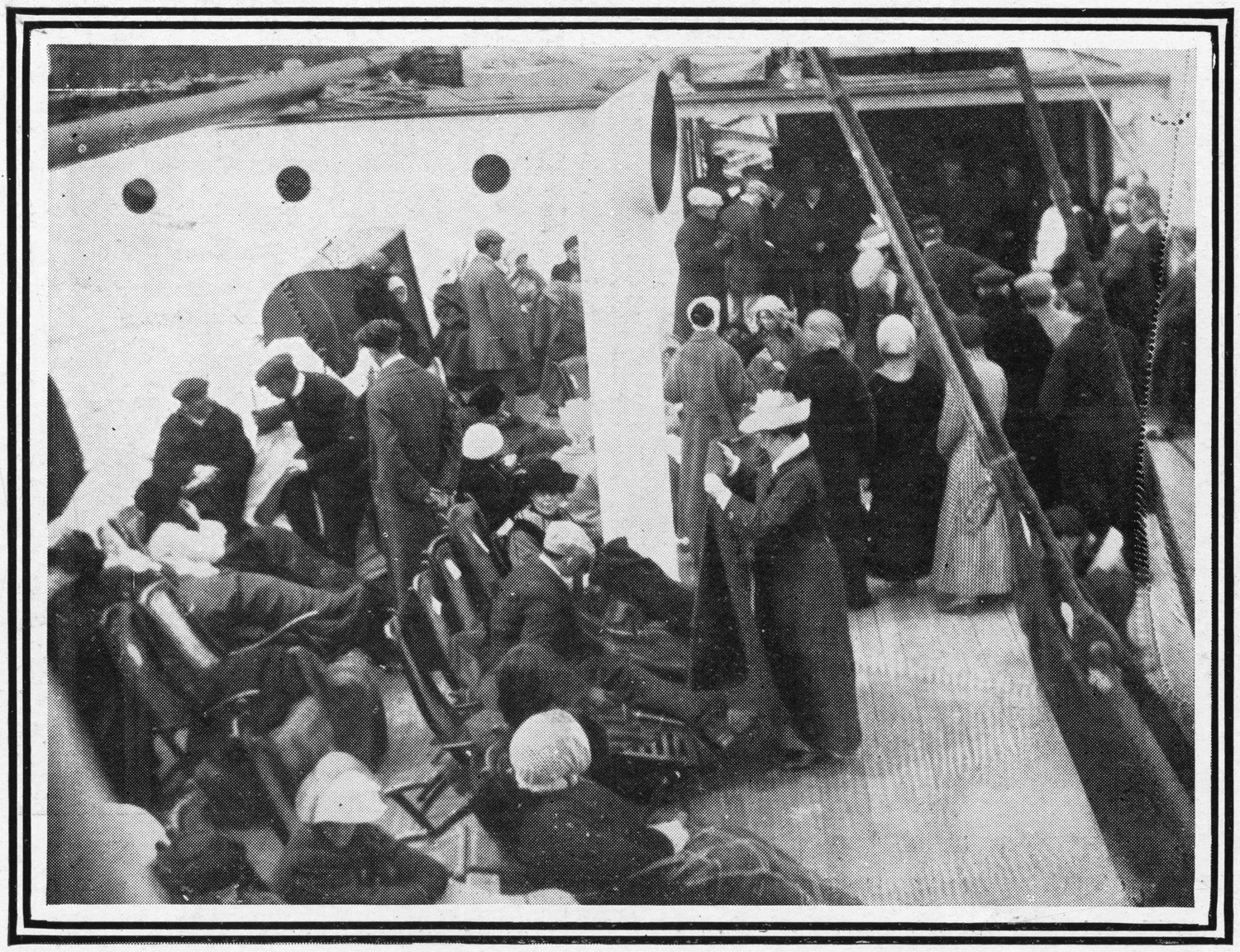 Passengers aboard the Carpathia help survivors of the Titanic after plucking more than 700 out of lifeboats, April 1912.