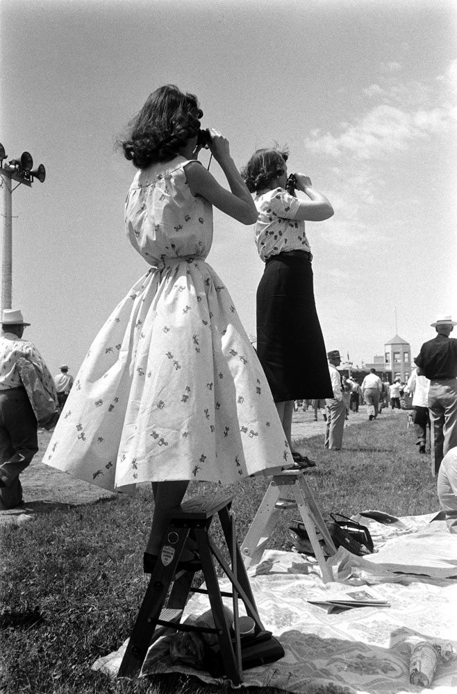 Spectators watch a race at Churchill Downs on Derby day, 1955.