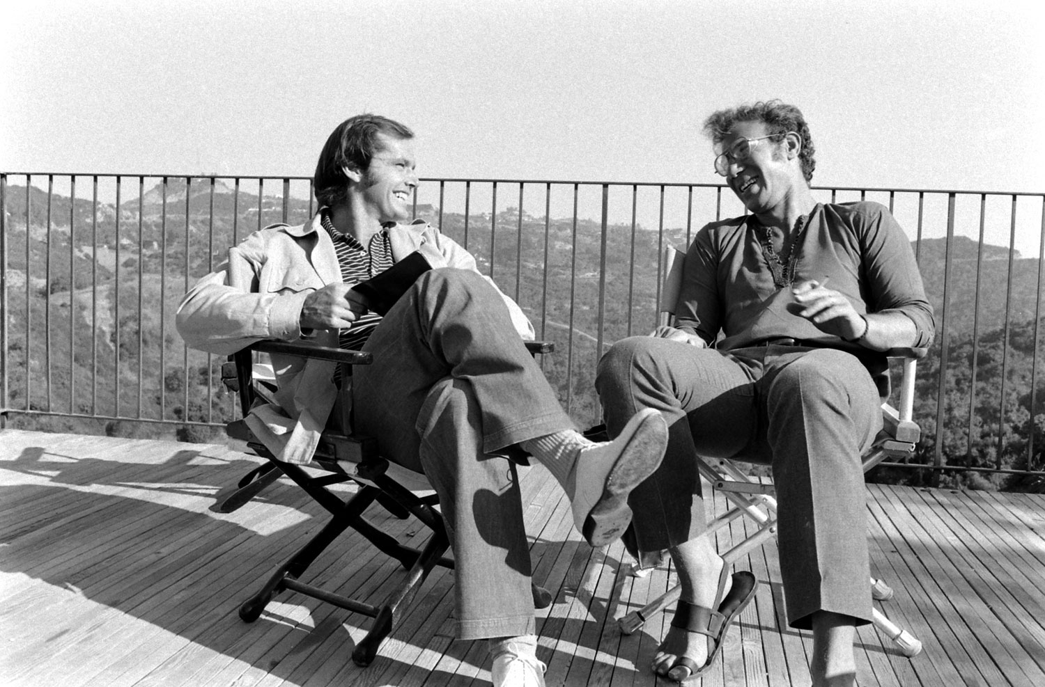 Jack Nicholson and director Bob Rafelson chat on the deck of Nicholson's home, Los Angeles, 1969.
