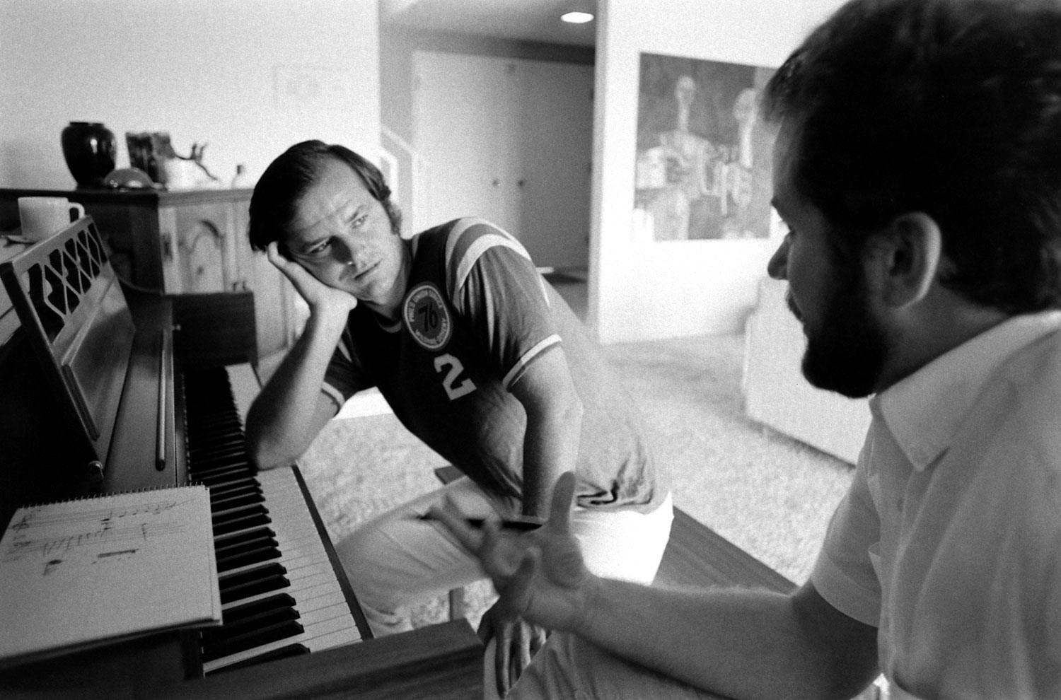 Jack Nicholson at home in 1969, taking his first piano lesson with teacher Josef Pacholczyk, prior to starring as a classical pianist-turned-roughneck in the 1970 classic, Five Easy Pieces.