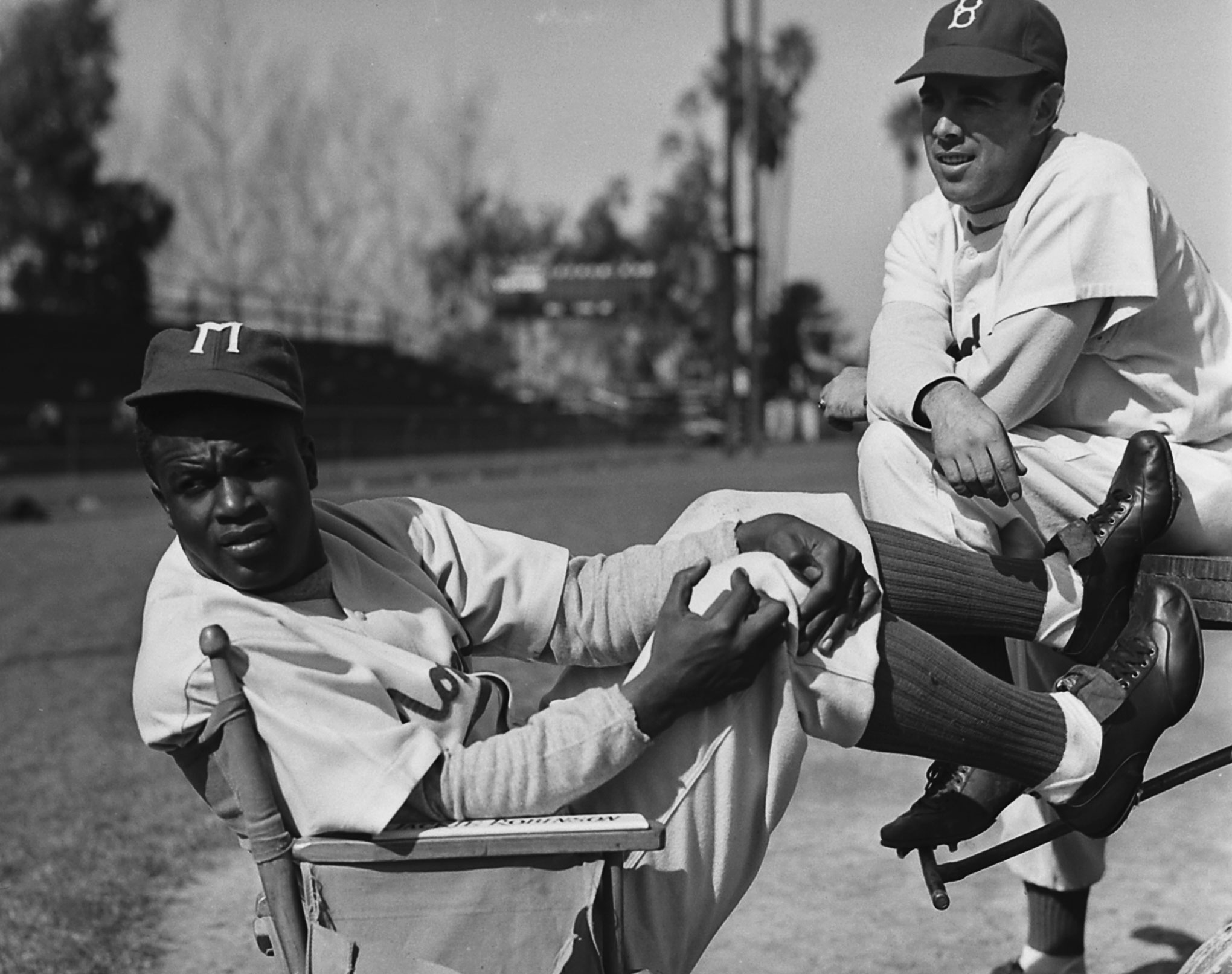 Jackie Robinson relaxes between takes on the set of the 1950 biopic, The Jackie Robinson Story, in which he starred as himself.