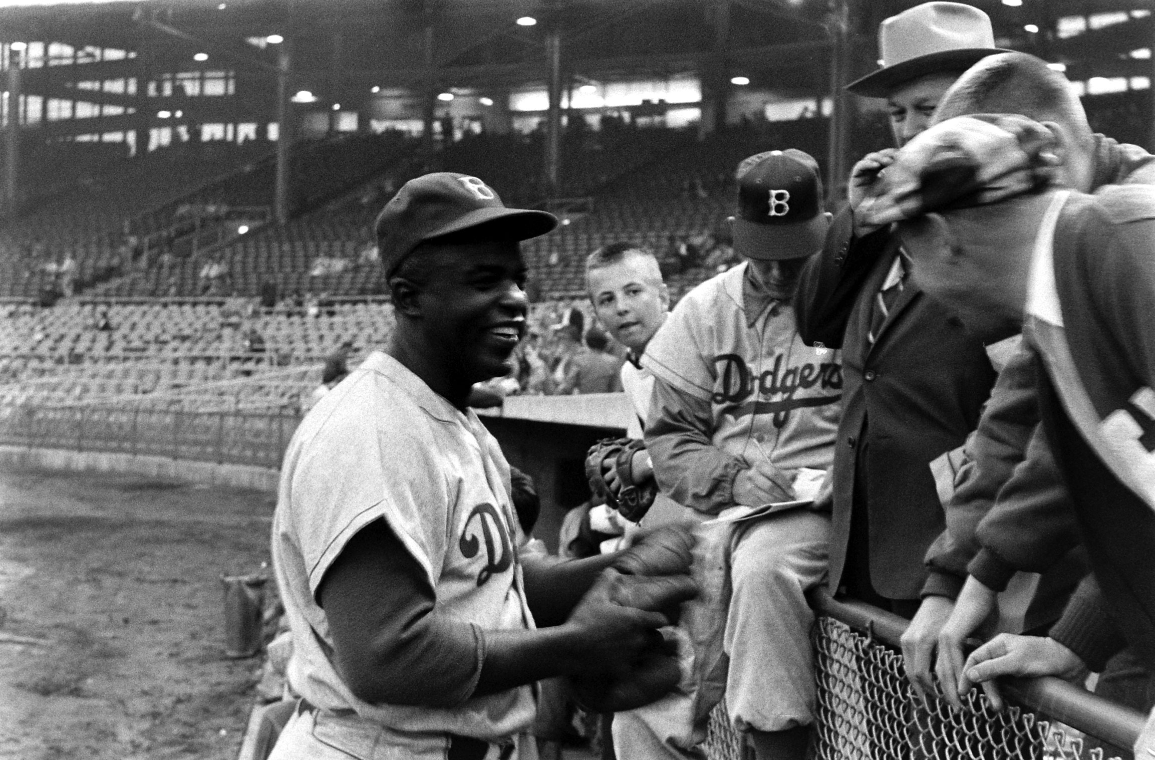 Jackie Robinson chats with fans in 1955.
