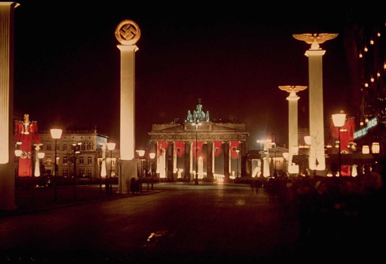 Berlin's Brandenburg gate and colonnades are lit up at night in honor of Adolf Hitler's 50th birthday, April 20, 1939.