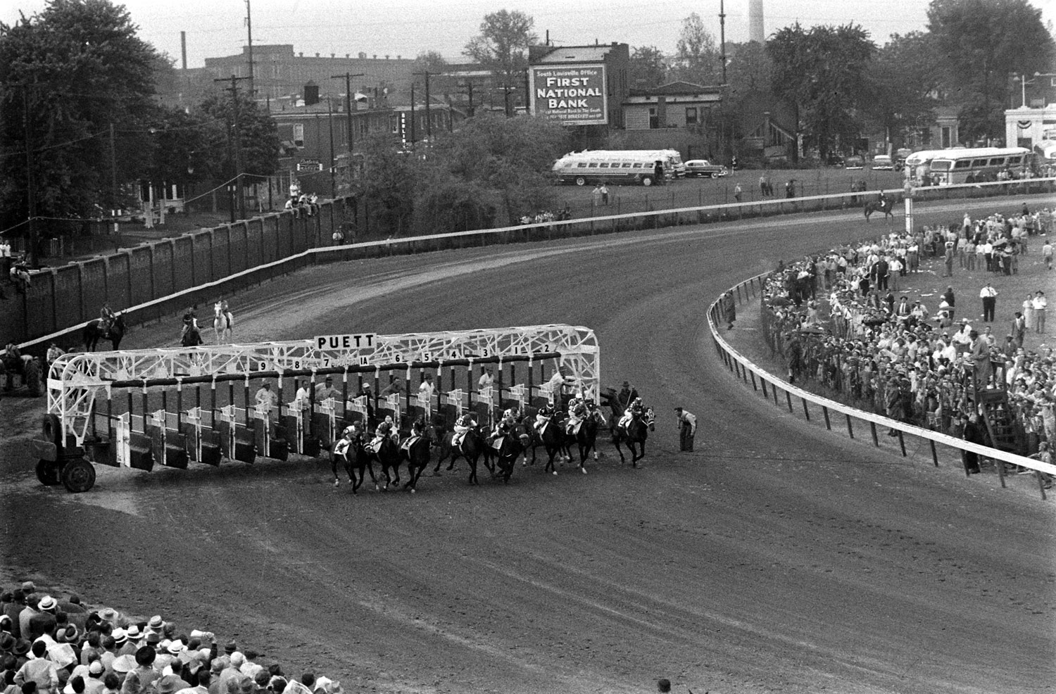 Starting gate at Churchill Downs on Derby day, 1955. Eventual winner Swaps is #7, favorite Nashua is #5.