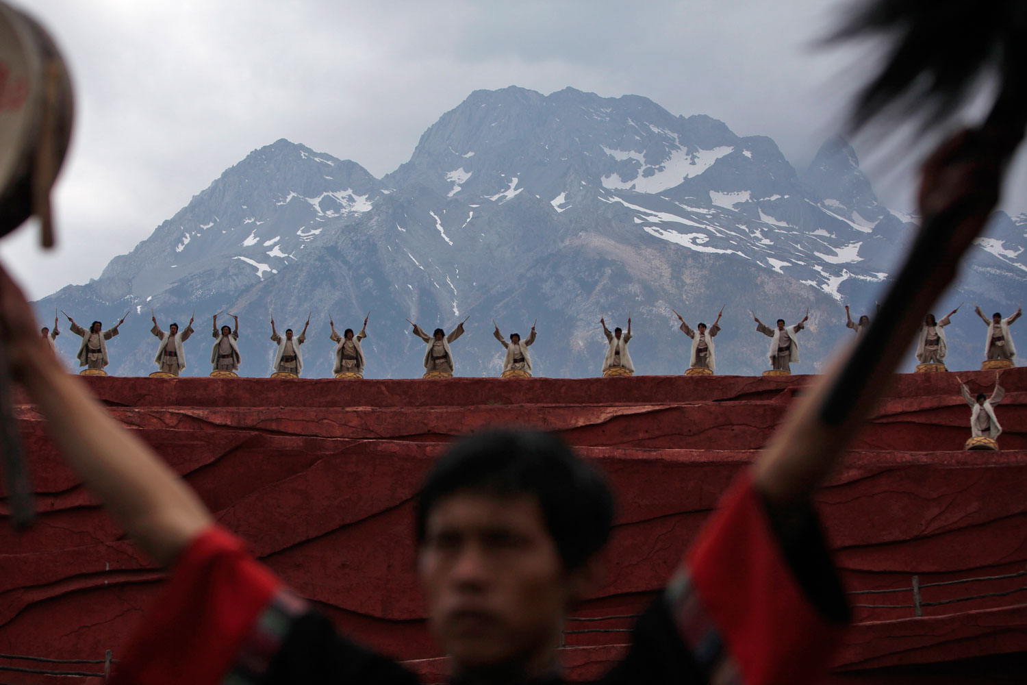April 5, 2012. Members of the Naxi, Yi and Bai ethnic minorities perform a cultural show entitled Impression Lijiang with Jade Dragon Snow Mountain as a backdrop, in Lijiang, Yunnan Province, China. Directed by Chinese filmmaker Zhang Yimou, the production aims to present the traditions and the lifestyle of these minorities.