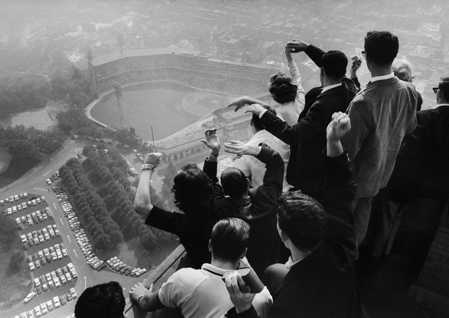 University of Pittsburgh students cheer wildly from atop the Cathedral of Learning as they look down on Forbes Field, where the Pittsburgh Pirates are playing the Yankees in the 7th game of a Series that would enter baseball lore when Bill Mazeroski smacked a 9th-inning, game-winning home run.