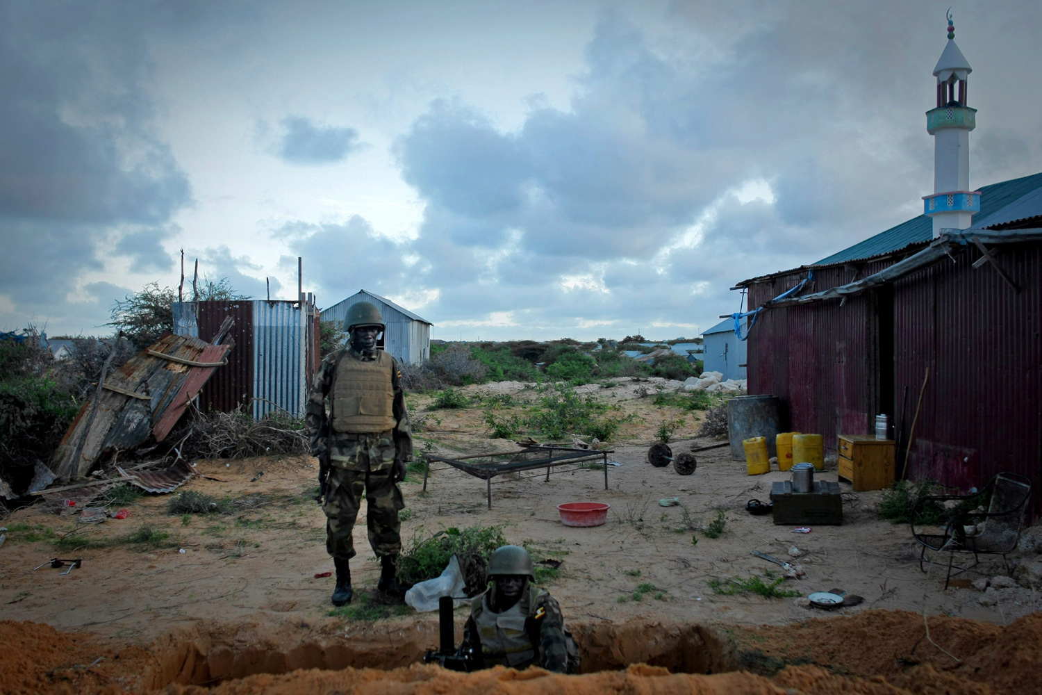 April 29, 2012. Ugandan soldiers serving with the African Union Mission in Somalia occupy a mortar position along the frontline of a defensive box position straddling the main road on the northern edge of Maslah Town, northwest of the Somali capital of Mogadishu.