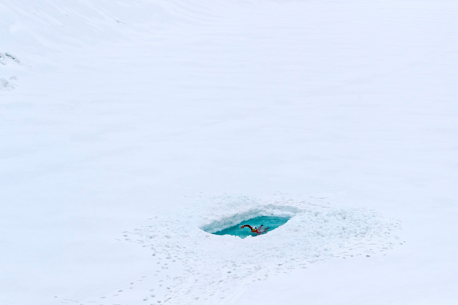 May 2, 2012. Ernst Bromeis is pictured in the ice-cold Toma Lake, at 2,345 m above sea level, near Disentis, Switzerland.