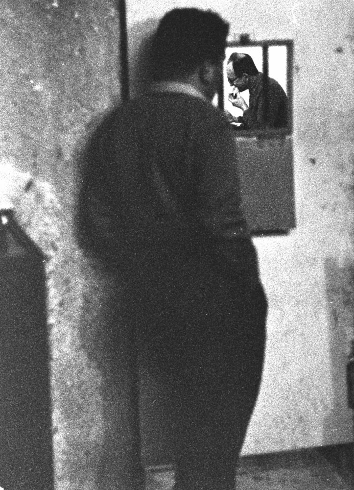 Adolf Eichmann awaits trial in Israel, 1961.