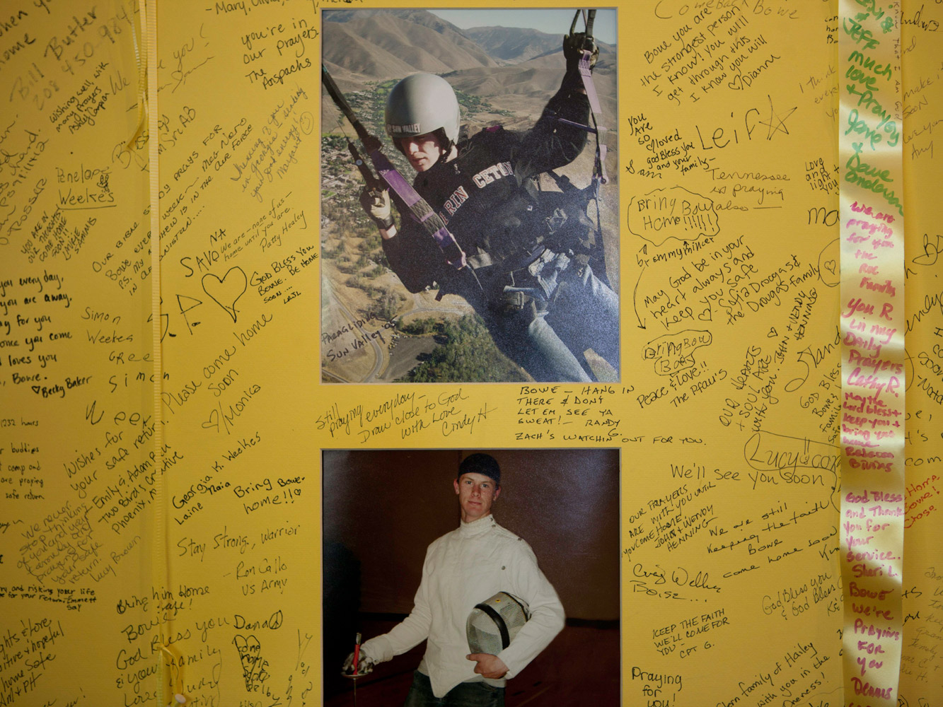 Photographs of Bowe Bergdahl on a large homemade poster that has been
                              signed by Bowe's loved ones and members of the community in Hailey, Idaho.
                              The poster is tacked to the wall in Zaney's coffee house.