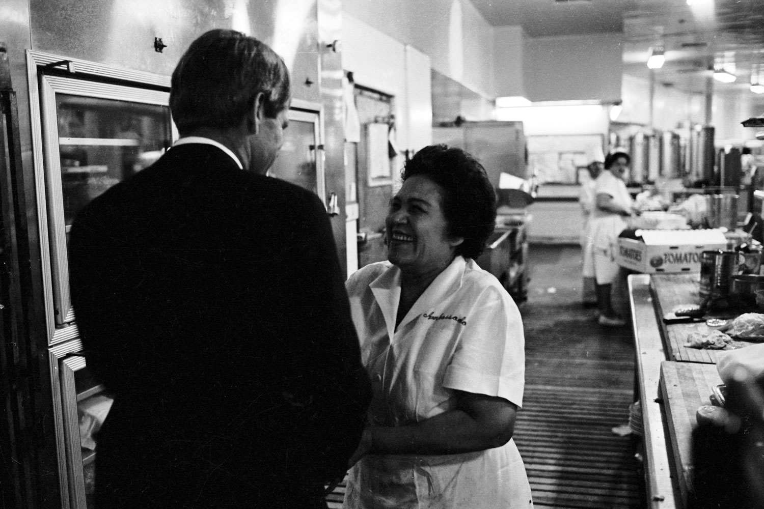 Heading for his victory speech in the Ambassador Hotel ballroom, Robert Kennedy stops in the kitchen to shake hands.
