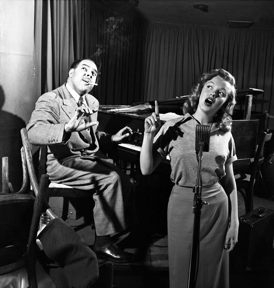Marilyn Monroe, 22, takes singing lessons with bandleader Phil Moore at the famous West Hollywood nightclub, the Mocambo, in 1949.
