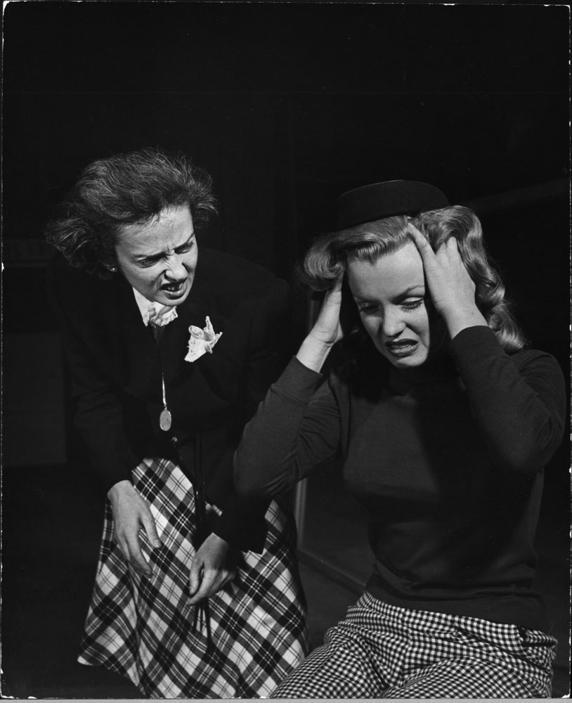 Marilyn Monroe, 22, takes lessons with acting coach, Natasha Lytess, Hollywood, 1949. The note that accompanied this picture when Eyerman's photos were sent to LIFE's editors read: "in the depths of human agony. For some incomprehensible reason, it was thought that the Lytess hat would help Marilyn for this mood."