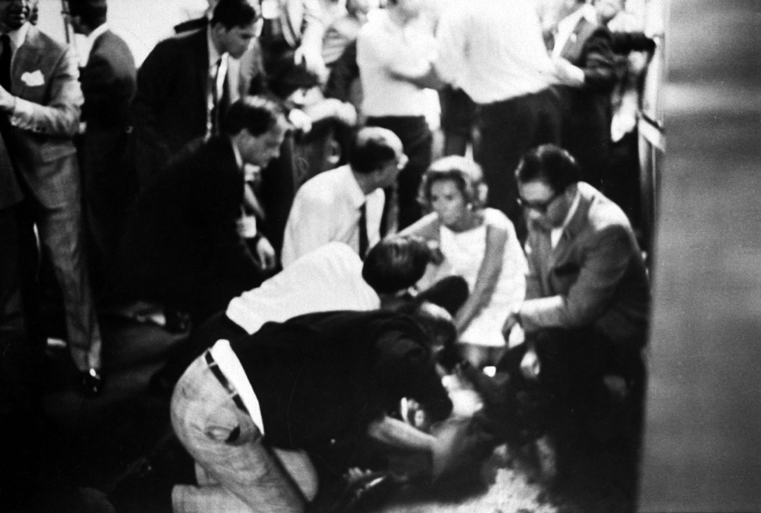 Mrs. Robert Kennedy and others surround a mortally wounded Robert Kennedy in the kitchen at the Ambassador Hotel, June 1968.