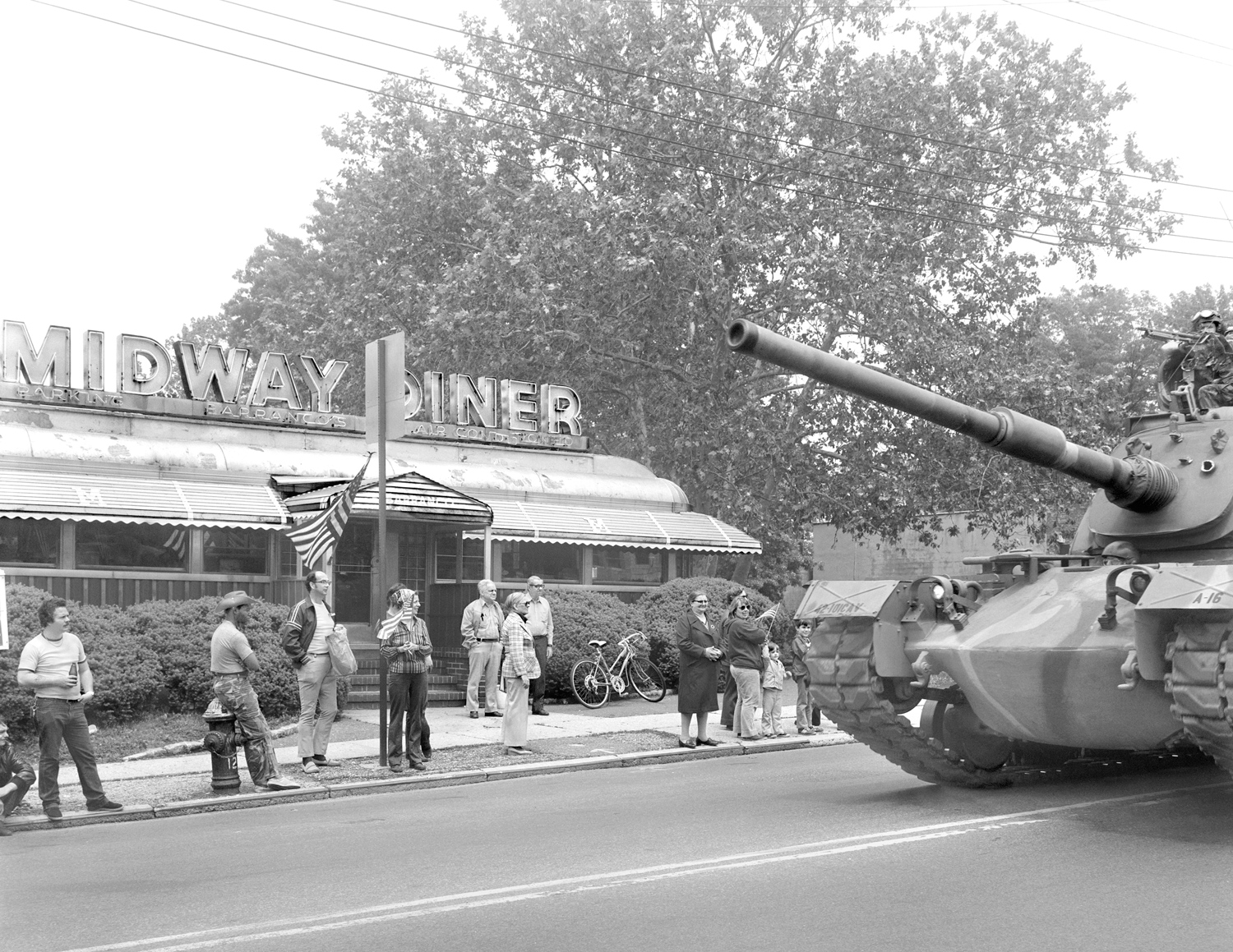 Midway Diner and tank during a parade.