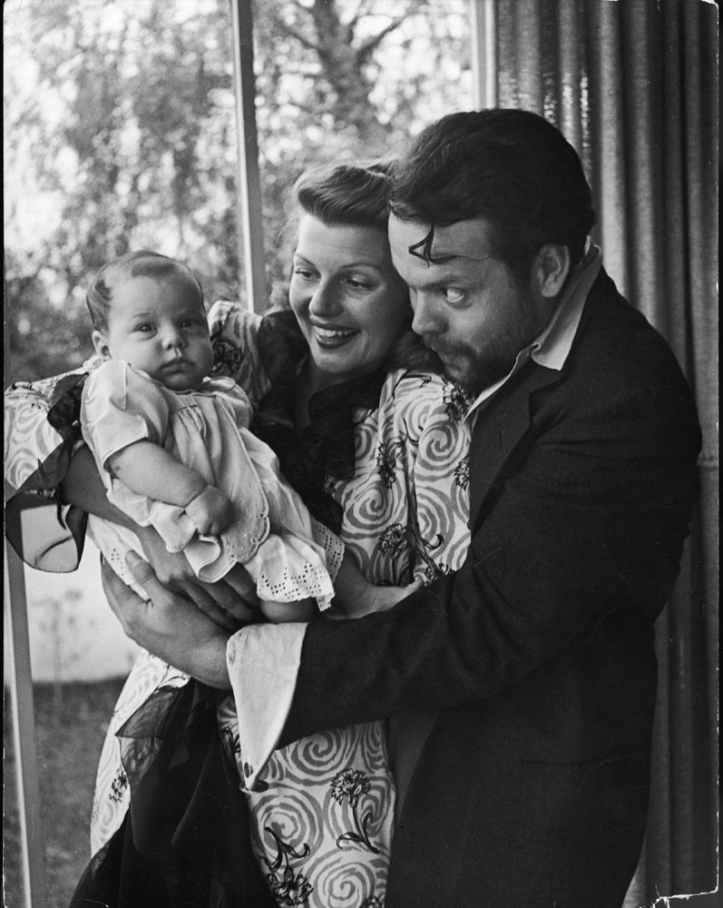 Orson Welles, wife Rita Hayworth and daughter Rebecca at home in 1945.