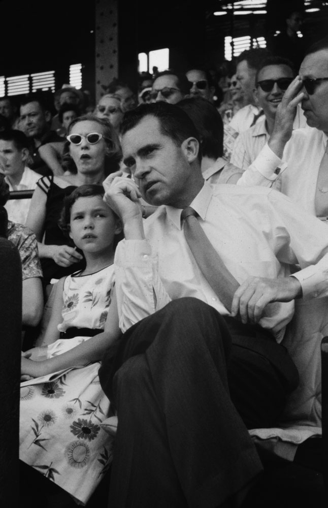 Vice President Richard Nixon and daughter Julie at a ballgame, 1958.