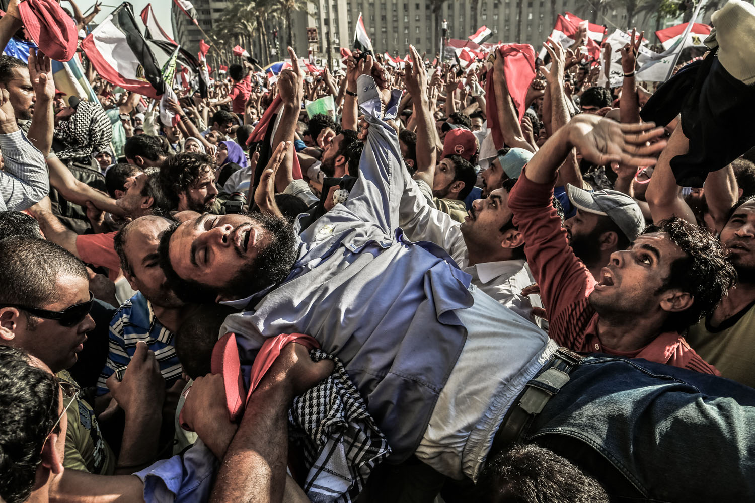 June 24, 2012, Cairo. Overcome by emotion, a supporter of the Muslim Brotherhood is carried onto the stage as Egyptians celebrate the election of their new president in Tahrir Square.