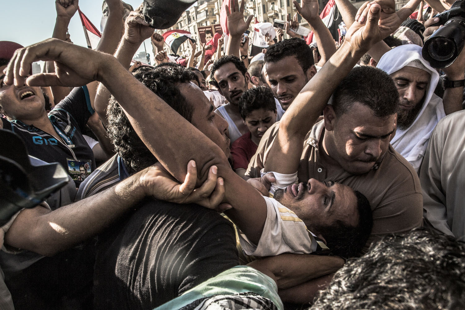 June 24, 2012, Cairo. A supporter of the Muslim Brotherhood is carried onto the stage as Egyptians celebrate.