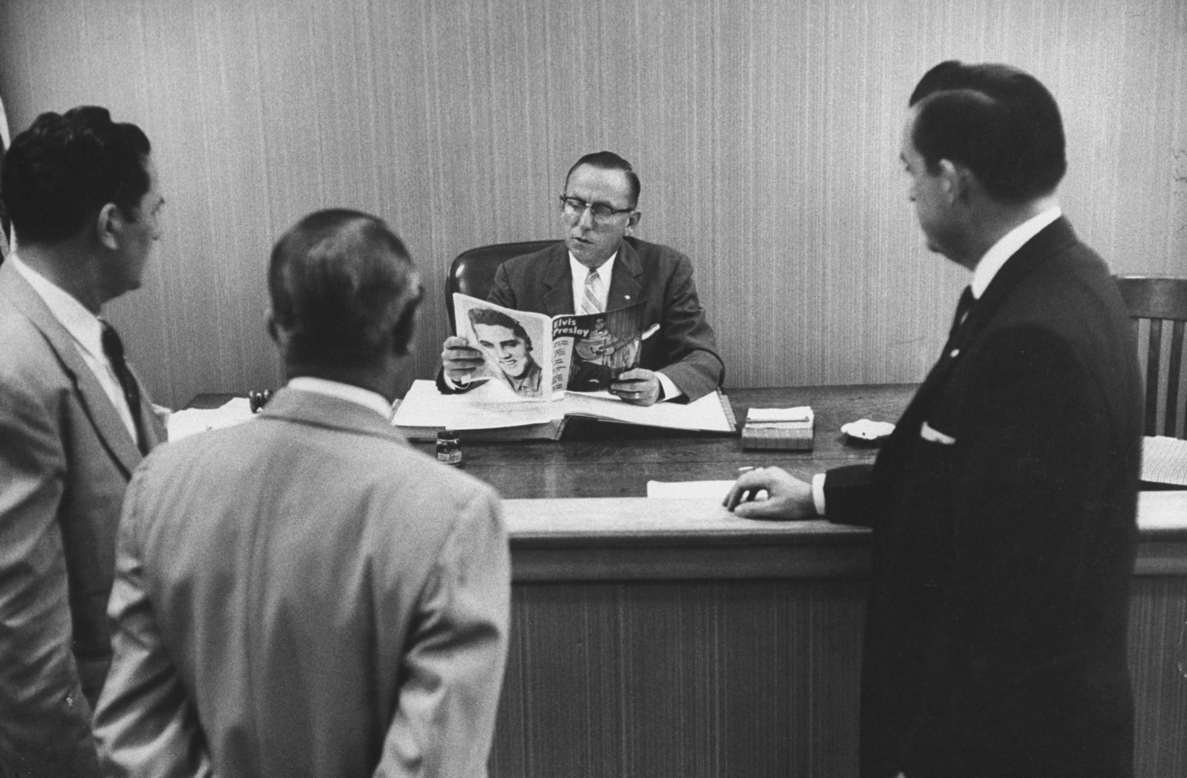 Civic leaders meet with a Jacksonville, Fla. judge to discuss ways of "curbing" Elvis Presley's influence on local teens, 1956.