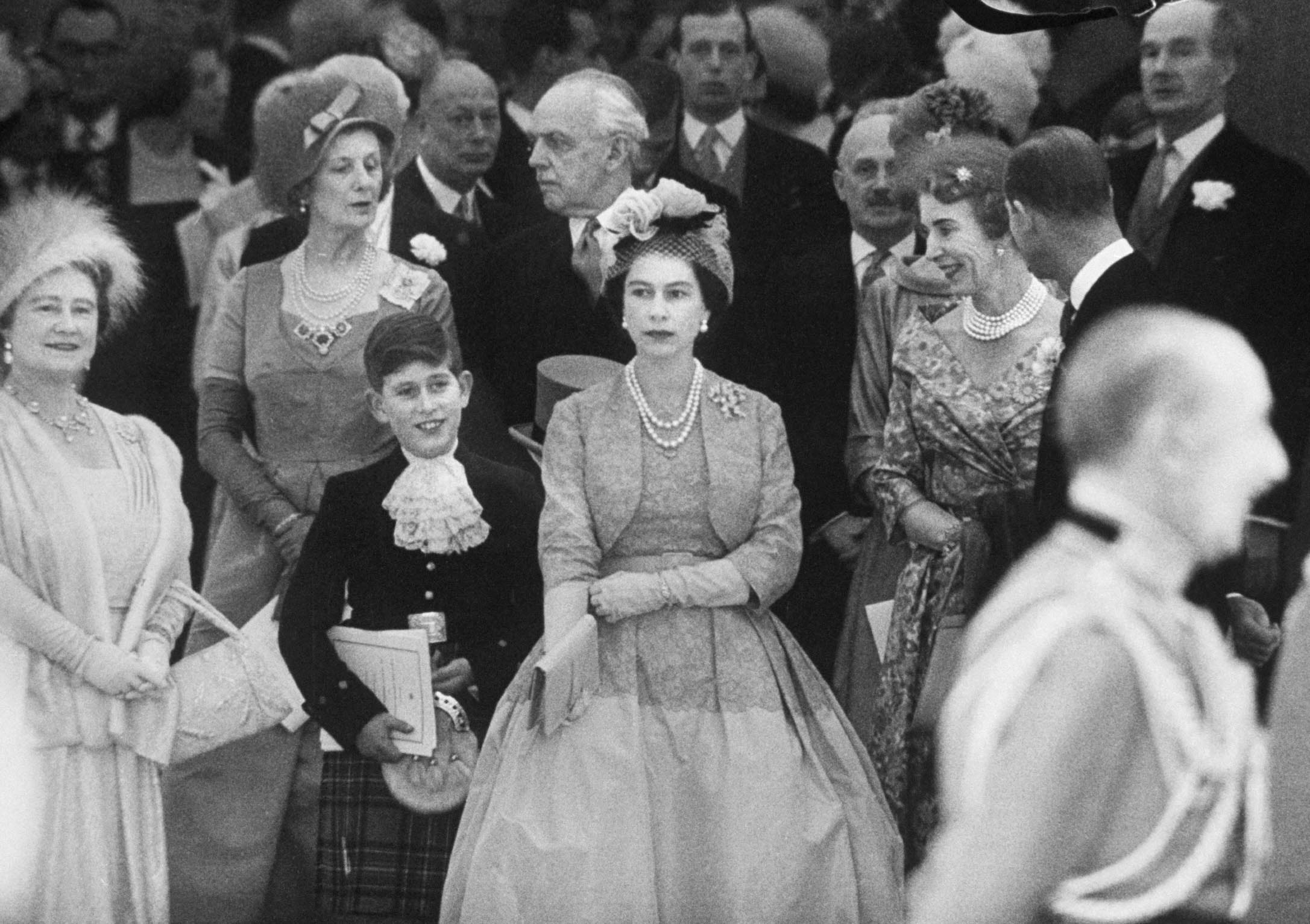 Queen Elizabeth with Prince Charles and Elizabeth II at Princess Margaret's wedding, 1960.