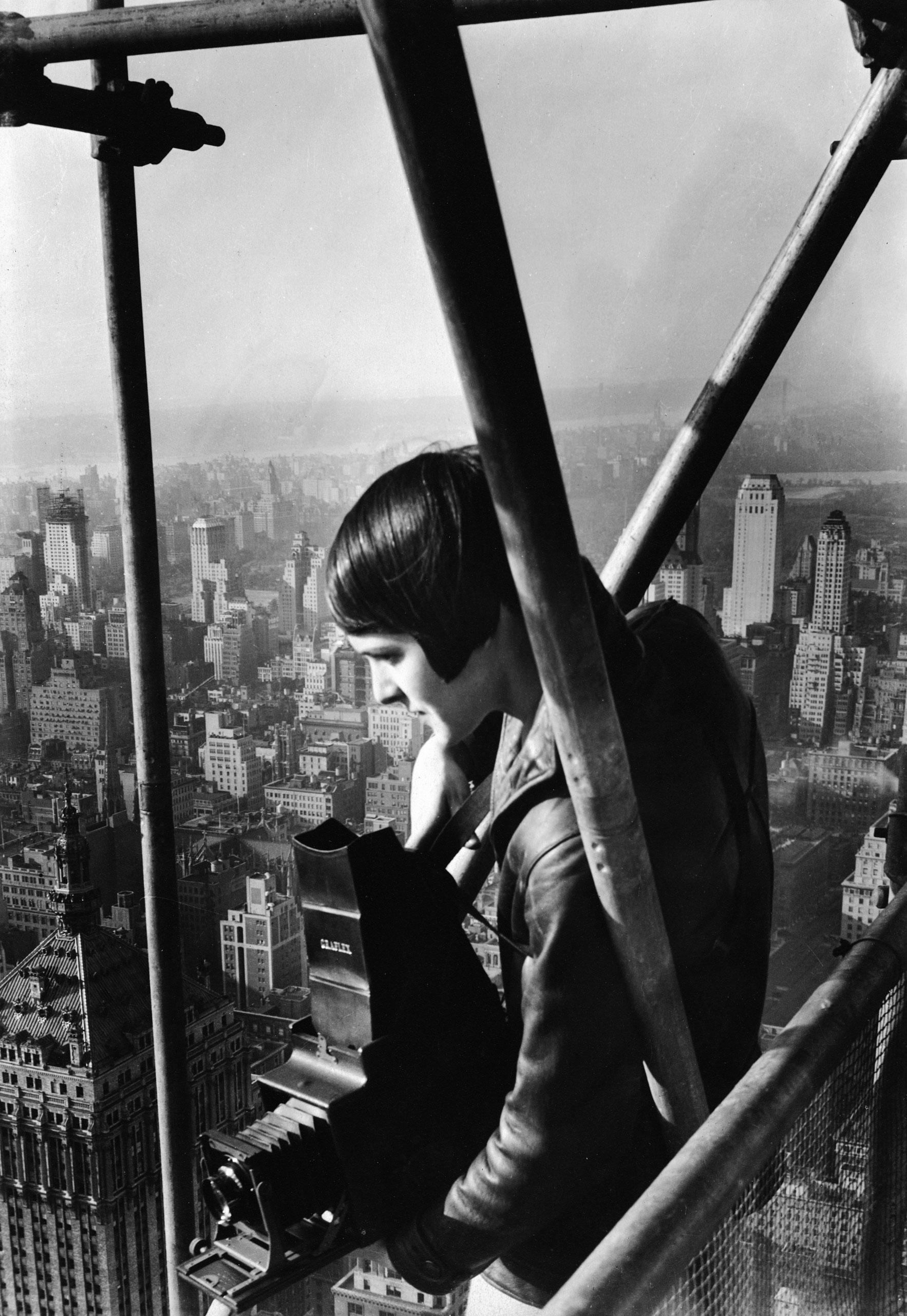 Margaret Bourke-White, 27, stands on the scaffolding enclosing the under-construction Chrysler Building in New York, 1931.