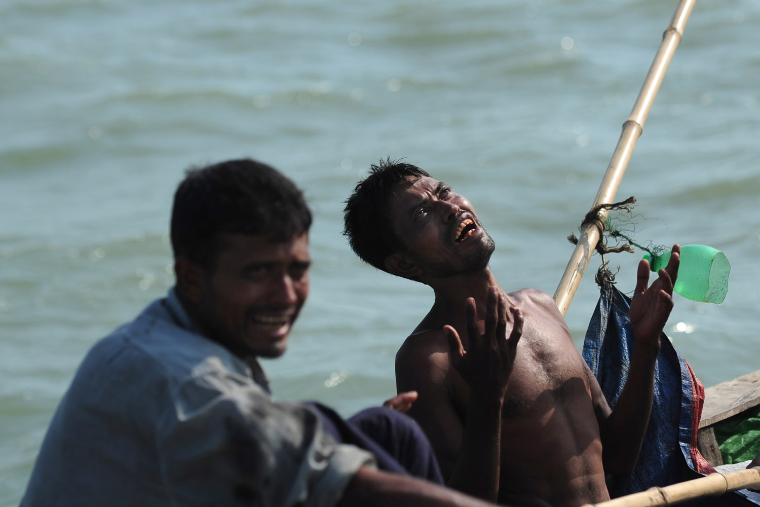 A Rohingya Muslim cries as he tries to cross the Naf river in Teknaf.