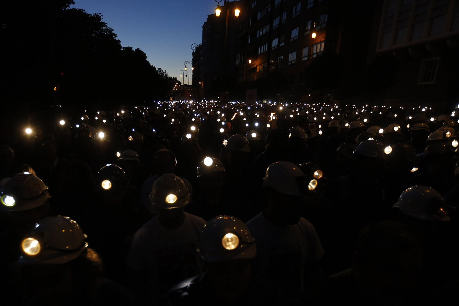 June 12, 2012. Spanish coal miners demonstrate with their lamps lit through the streets of the city of Leon, northern Spain. Spanish coal miners are staging a nationwide strike action organized by unions opposed to subsidy reductions from 300 million euros to 110 million euros.