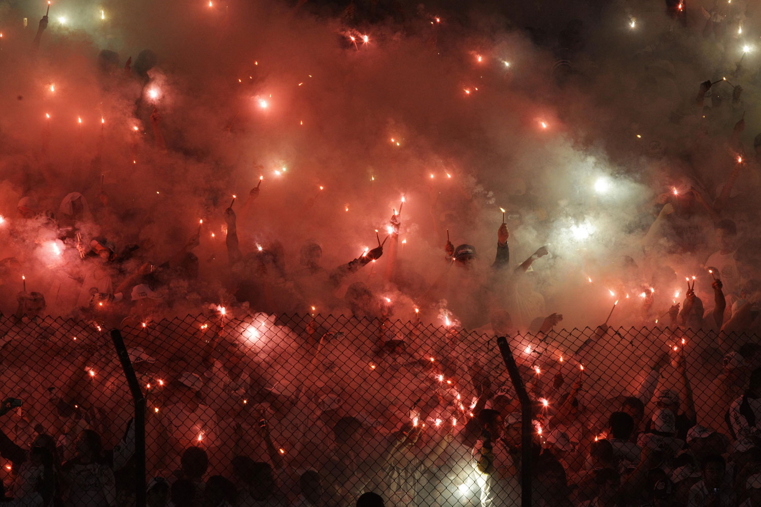June 13, 2012. Brazil's Santos fans cheer during a Copa Libertadores soccer match against Brazil's Corinthians in Santos, Brazil.