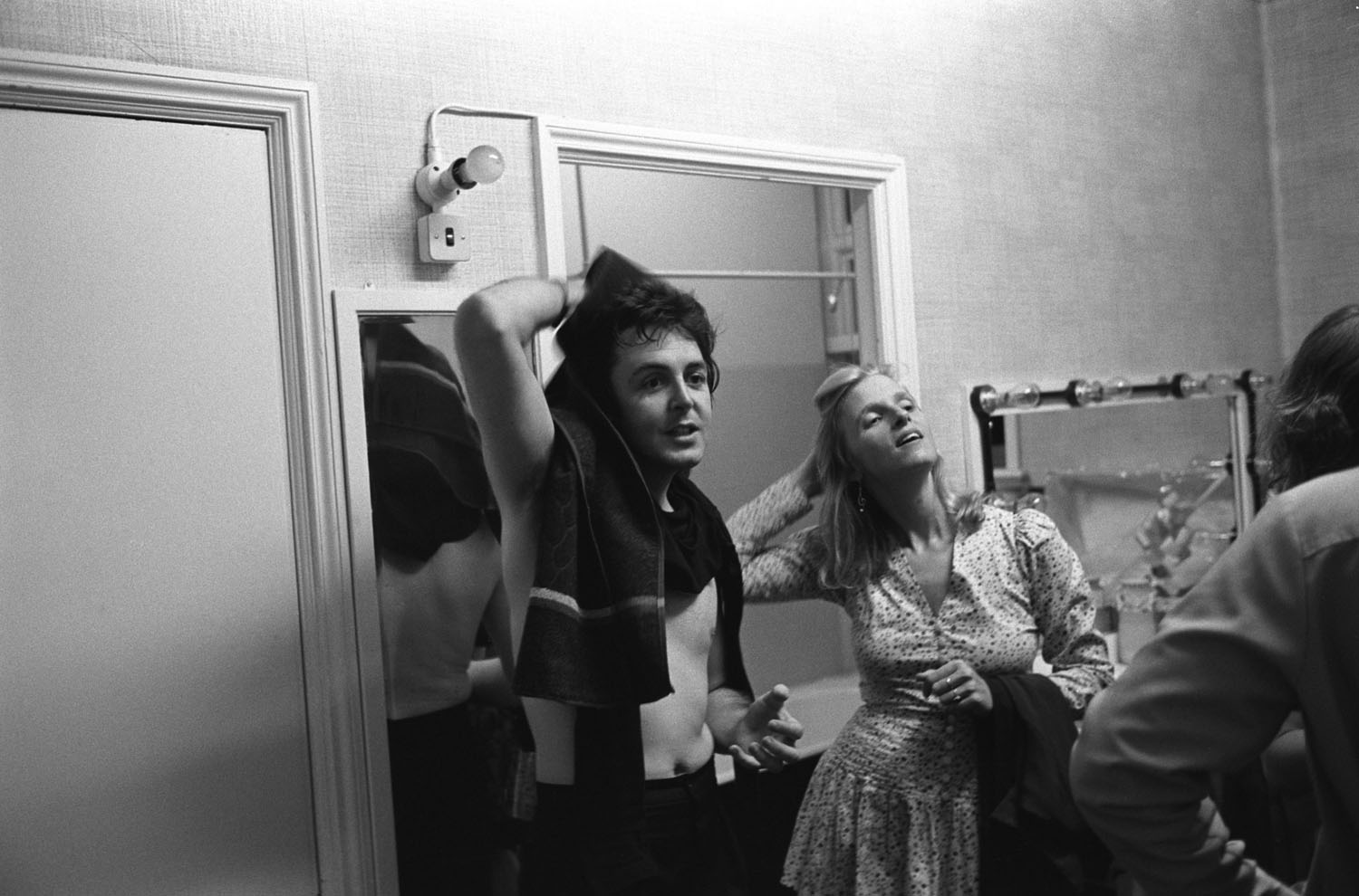 Paul and Linda McCartney in their dressing room after their performance in Bristol, England, during their band Wings' tour 1975.