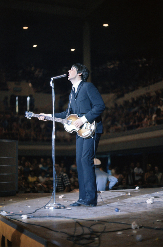 Paul McCartney on stage during The Beatles' concert at the Sam Houston Coliseum, Texas, August 19, 1965.
