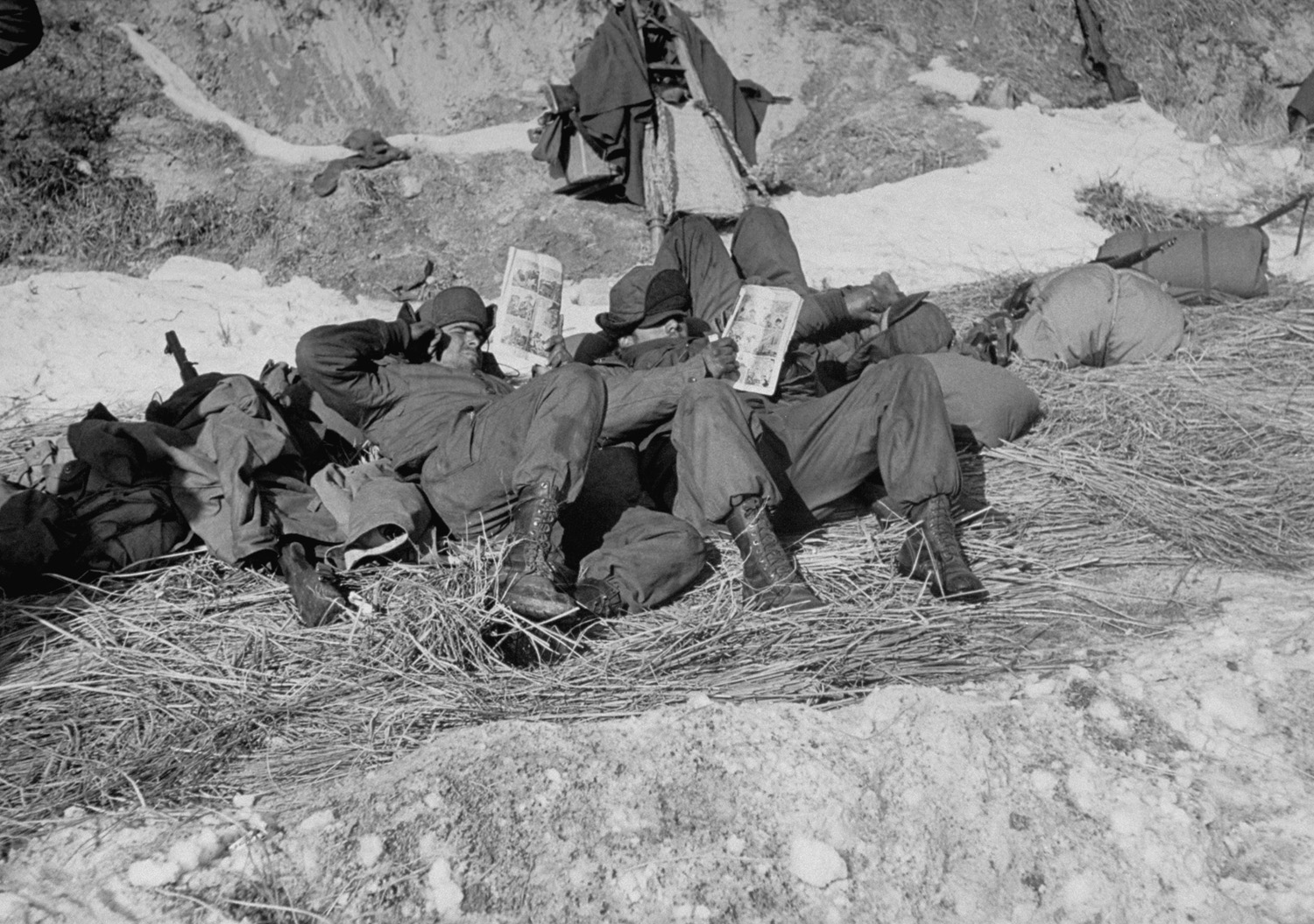 American troops read comic books during the Korean War, 1951.
