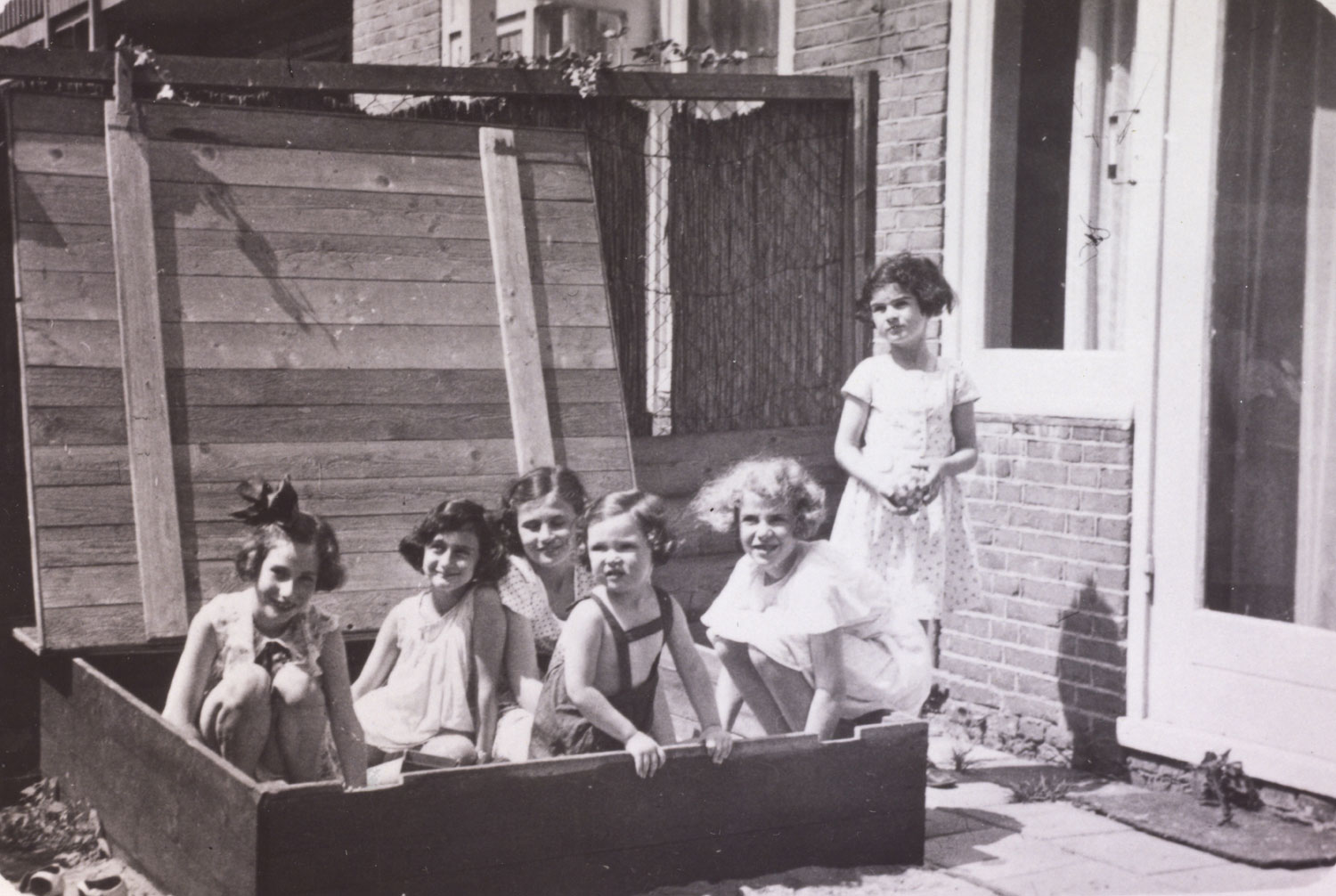Left to right: Hanneli Goslar (a.k.a., "Lies Goosens" in early editions of the Diary), Anne Frank, Dolly Citroen, Hannah Toby, Barbara Ledermann and Susanne Ledermann (standing), Amsterdam, 1937.