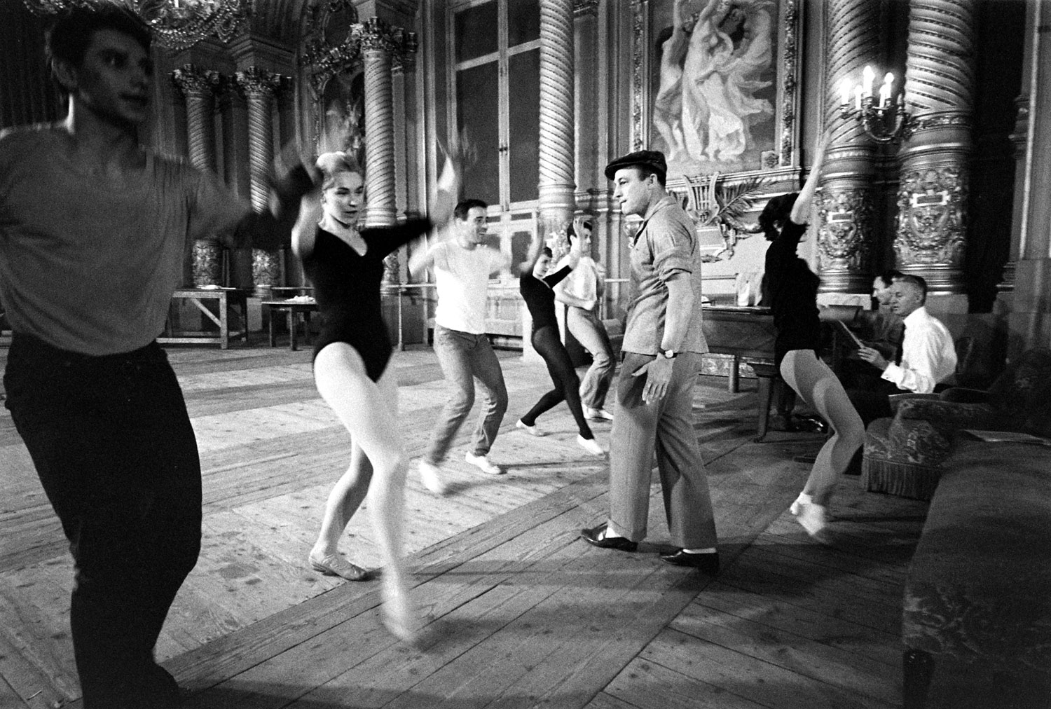 Gene Kelly rehearses with ballerina Claude Bessy and other dancers, Paris, 1960.