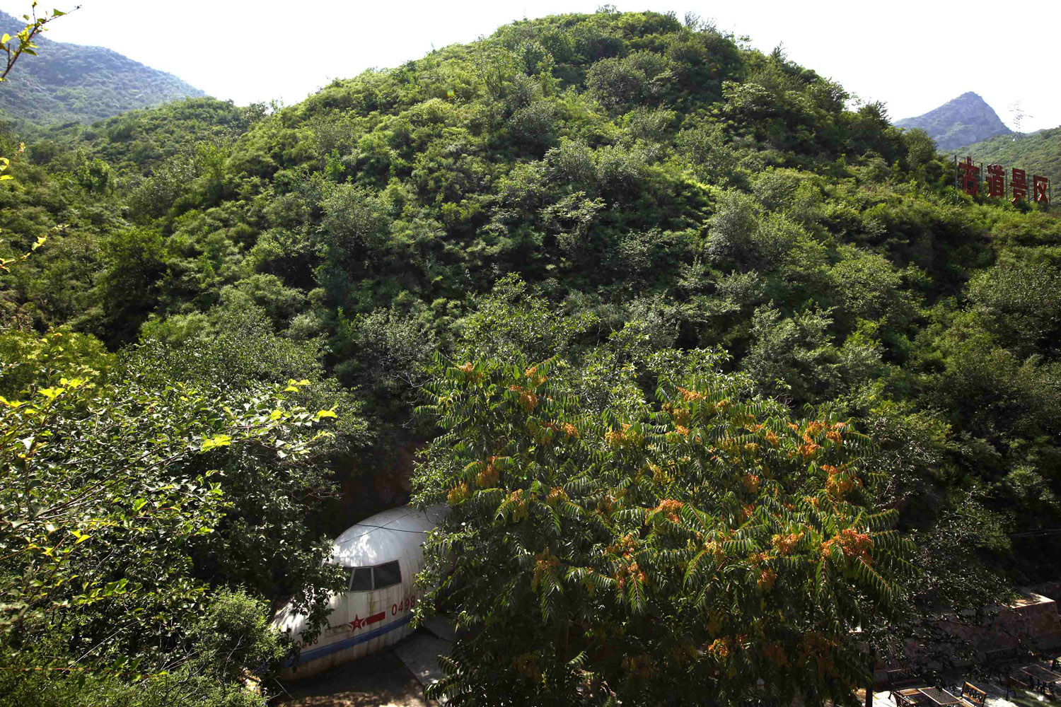 July 16, 2012. The entrance to a cave, shaped in the form of an aeroplane, can be seen under a mountain that was once the headquarters of former Chinese Communist military leader Lin Biao located on the outskirts of Beijing.