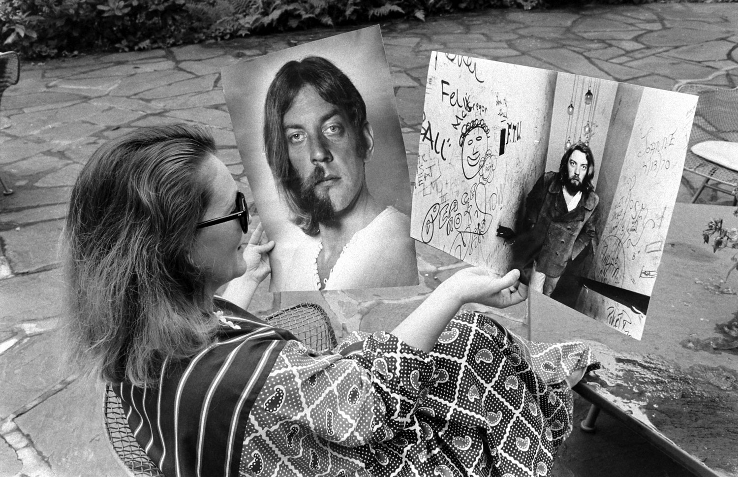 Shirley Douglas looks at pictures of her husband, Donald Sutherland, 1970.