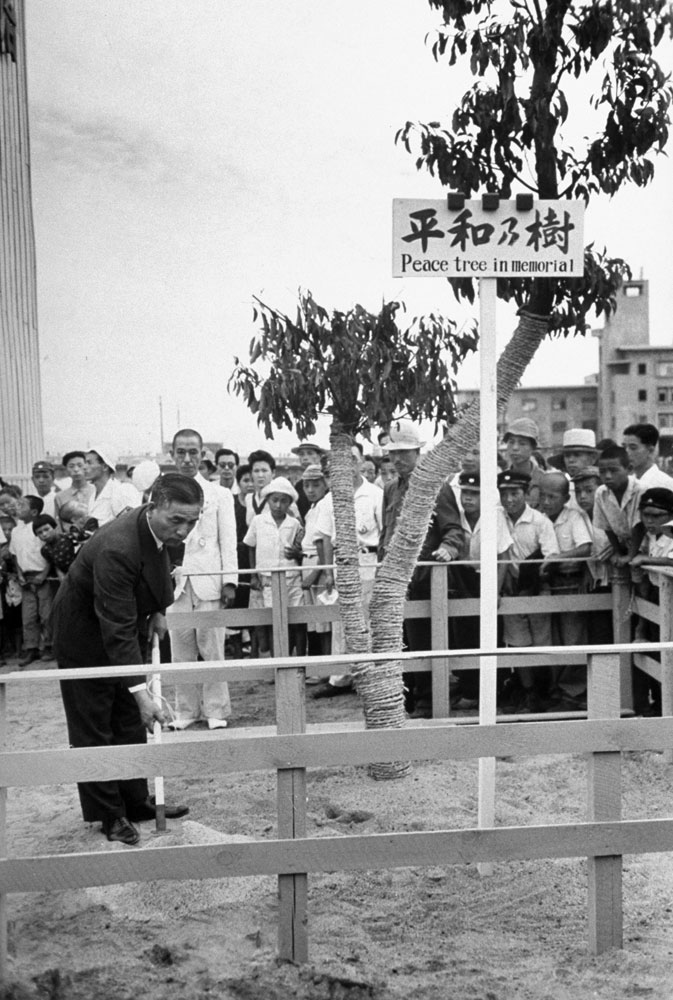 A tree-planting ceremony during a "Peace Festival" in Hiroshima Japan, on the two-year anniversary of the United States' August 1945 atomic attack on the city.