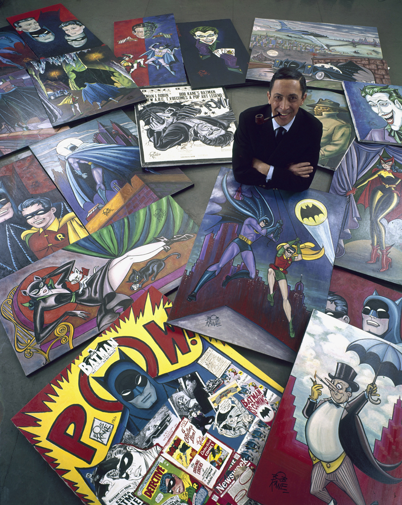 Comic book artist Bob Kane, who created Batman, poses with his iconic illustrations, 1966.