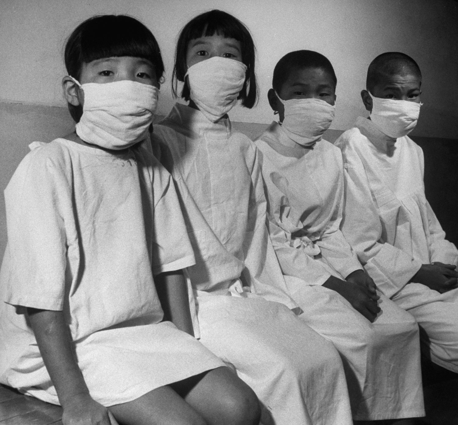 Hiroshima's children patiently wait their turn for a complete and detailed physical examination in ABCC's [Atom Bomb Casualty Commission] temporary laboratory clinic.