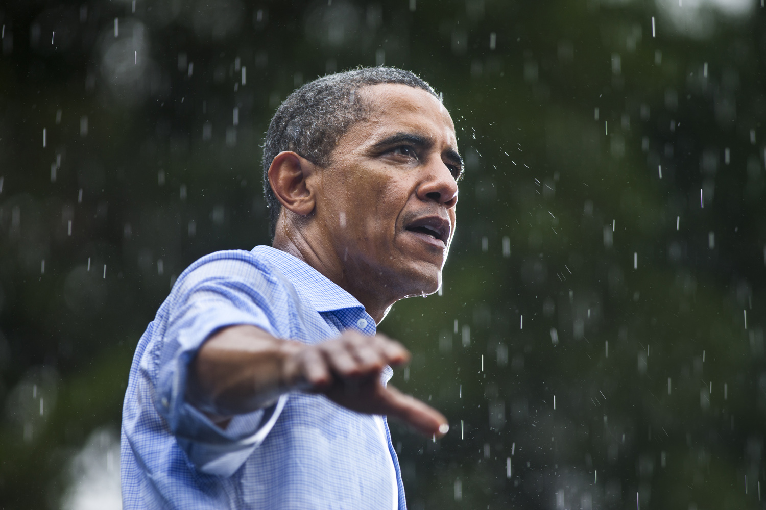 July 14, 2012. Barack Obama speaks in the rain during a campaign rally in Glen Allen, Va.
