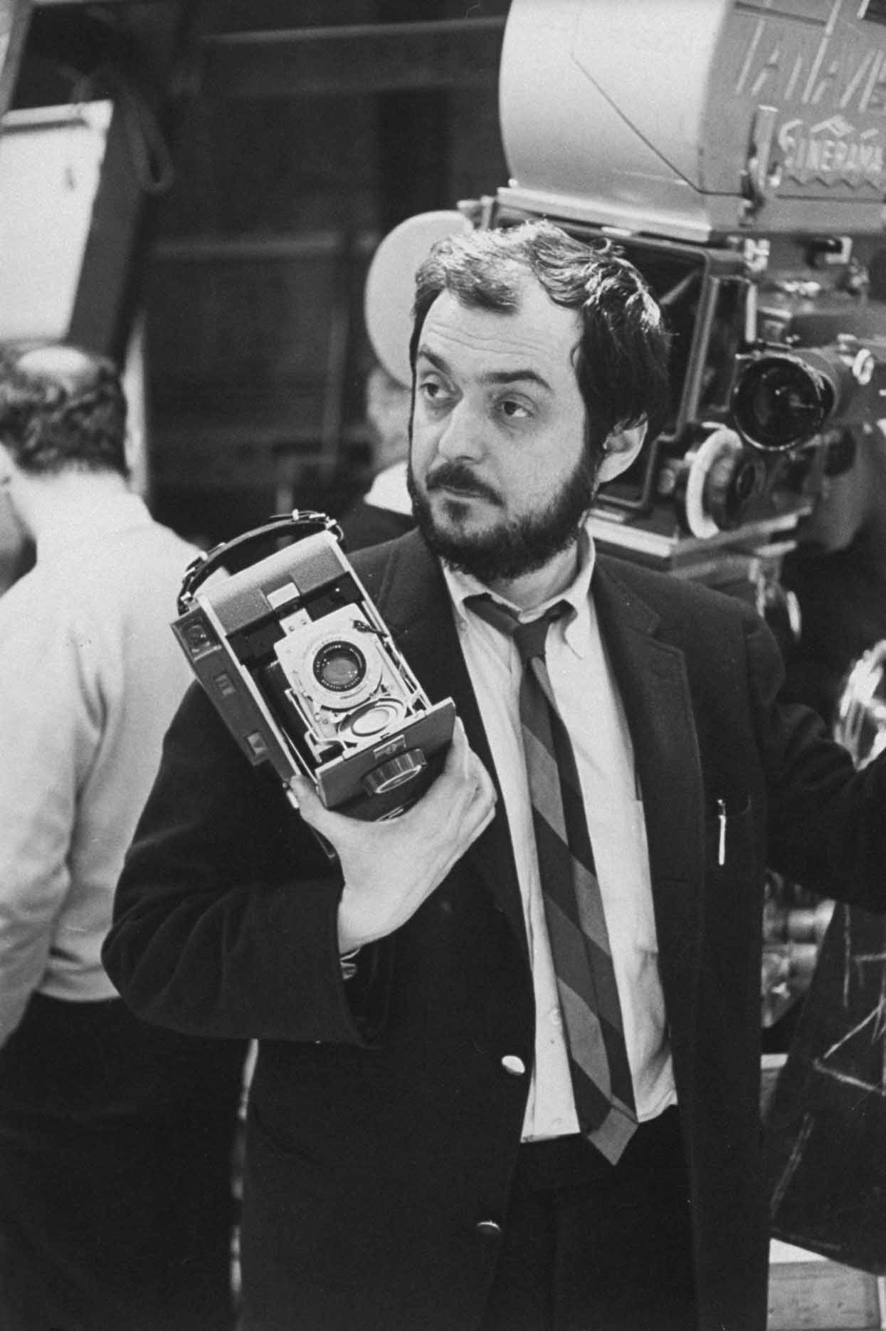 Film director Stanley Kubrick holding polaroid camera during the filming of his movie "2001: A Space Odyssey".