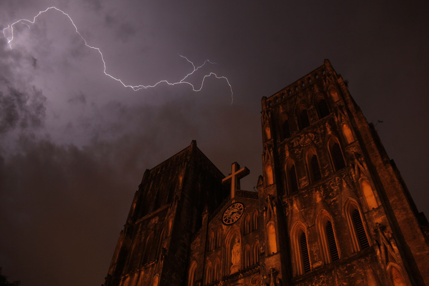 July 14, 2012. Lighting strikes over Saint Joseph cathedral during a storm in Hanoi.