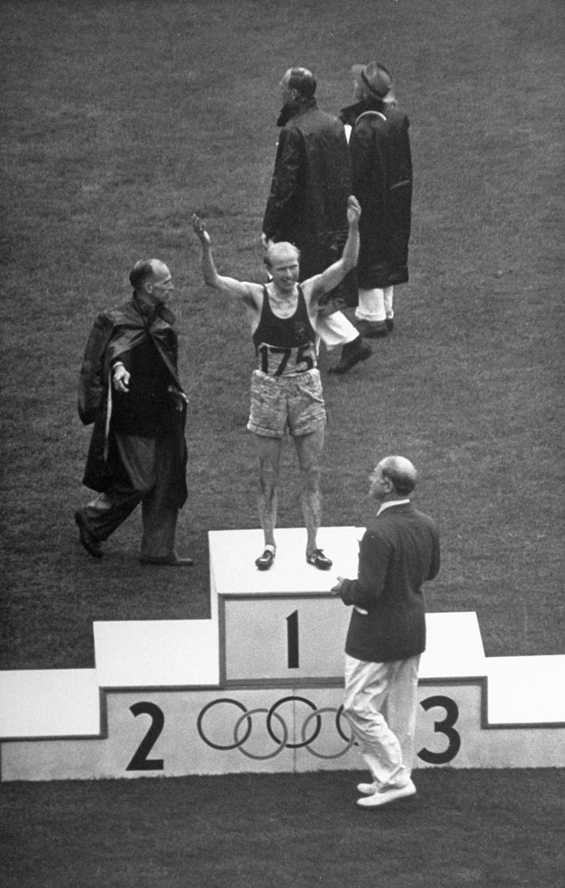 Gaston Reiff of Belgium stands on the winner's block after the 5,000 meters, London, 1948.