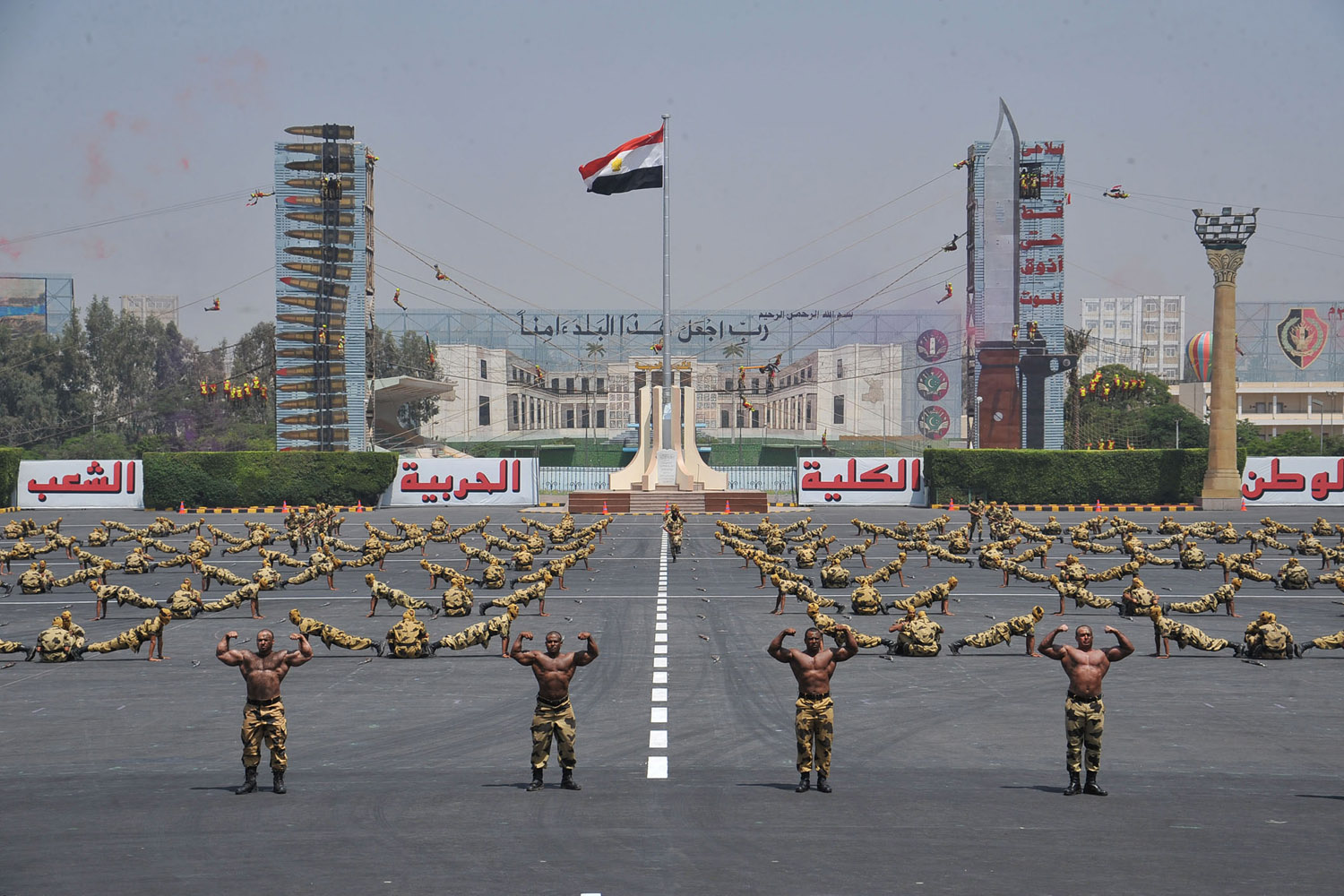 July 17, 2012. Egyptian troops demonstrate their skills at a graduation ceremony attended by President Mohammed Morsi, unseen, in Cairo.