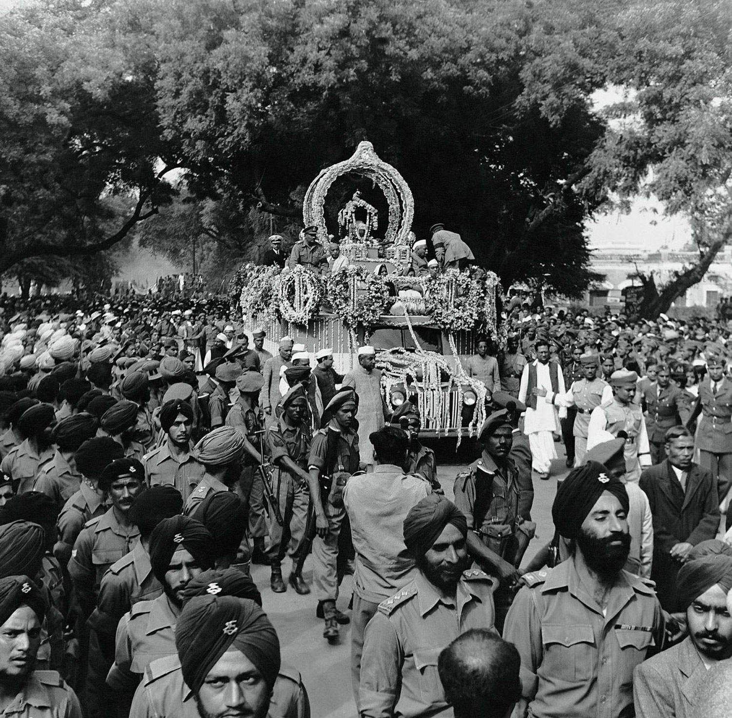 The ashes of Mahatma Gandhi being carried in a procession in Allahabad, Feb. 1948
